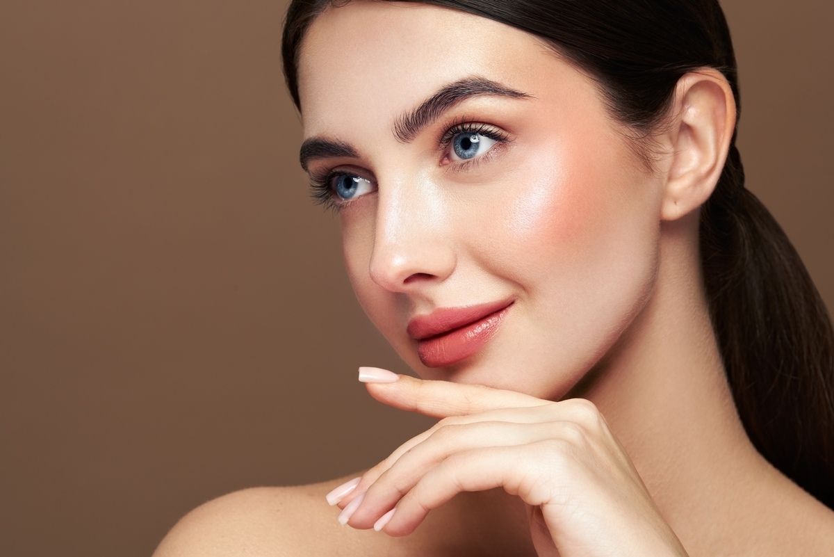Woman with smooth firm glowing skin representing the aesthetic results of XERF vs Botox skin treatments